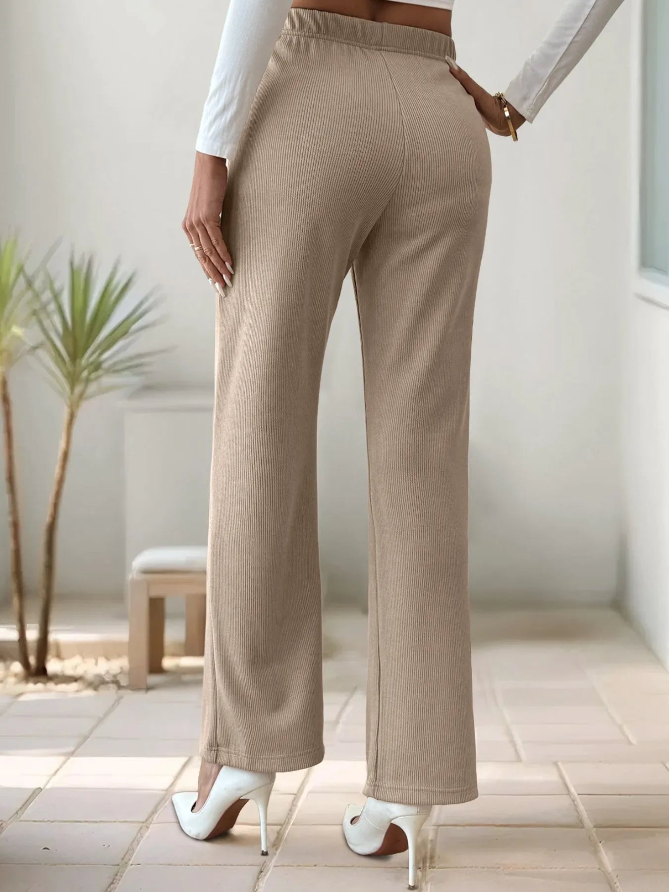 Khaki high-waisted wide-leg pants with elastic waistband and front slit detail
