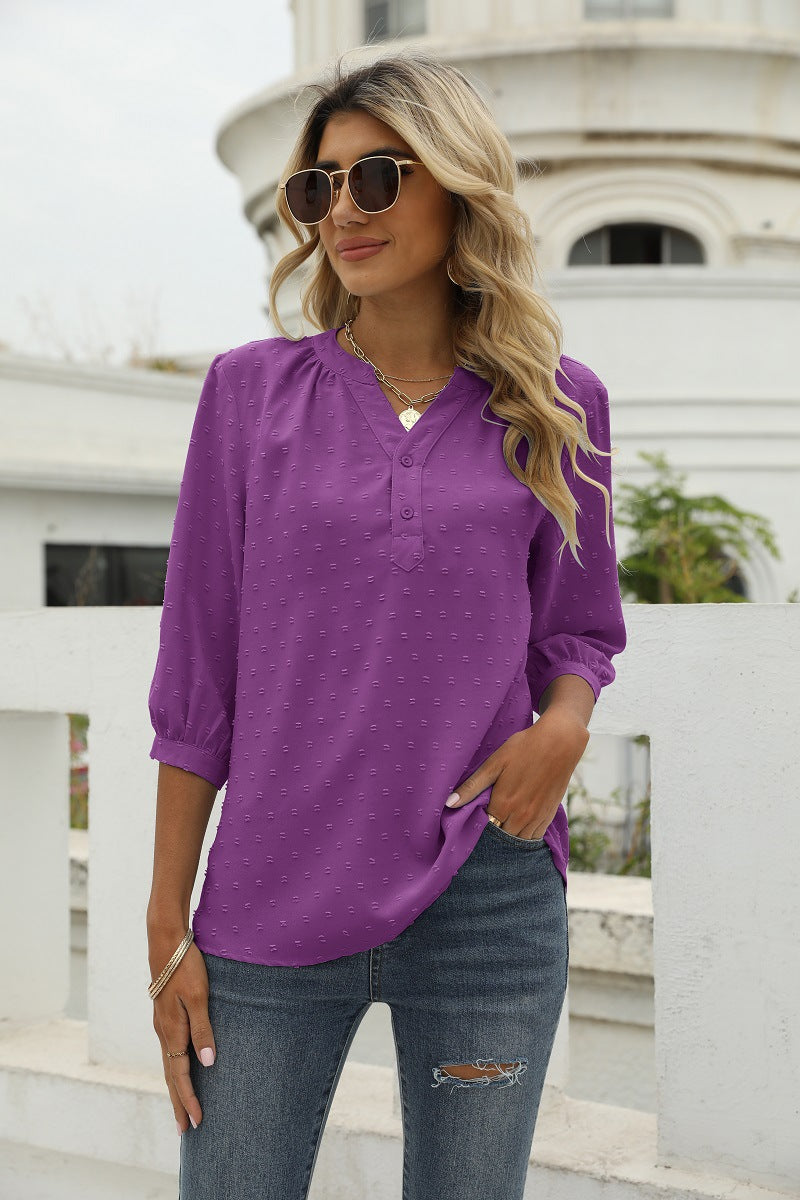 Purple Swiss-dot notched-neck blouse with 3/4 puff sleeves and button front