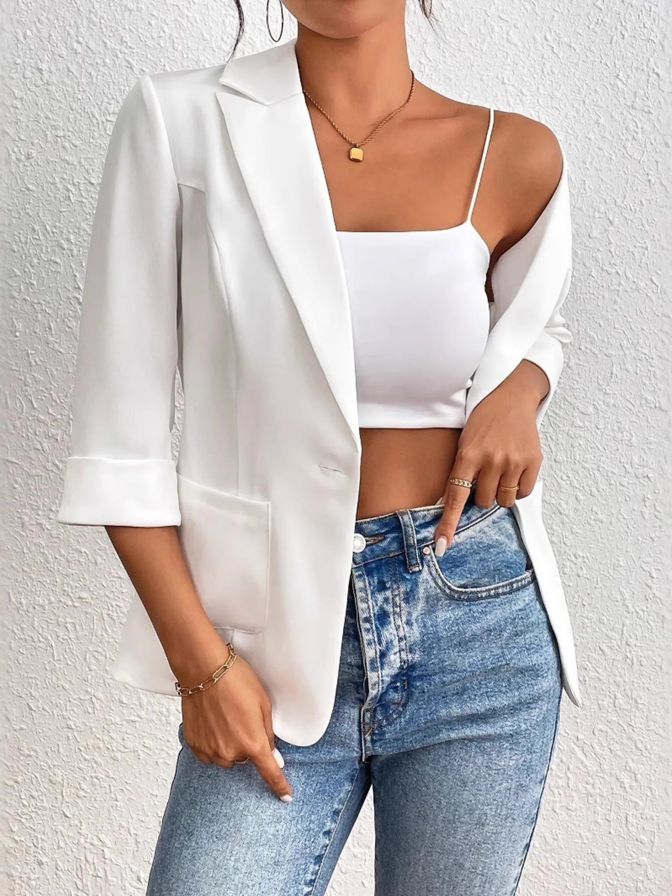 White one-button lapel blazer with 3/4 sleeves and front pockets