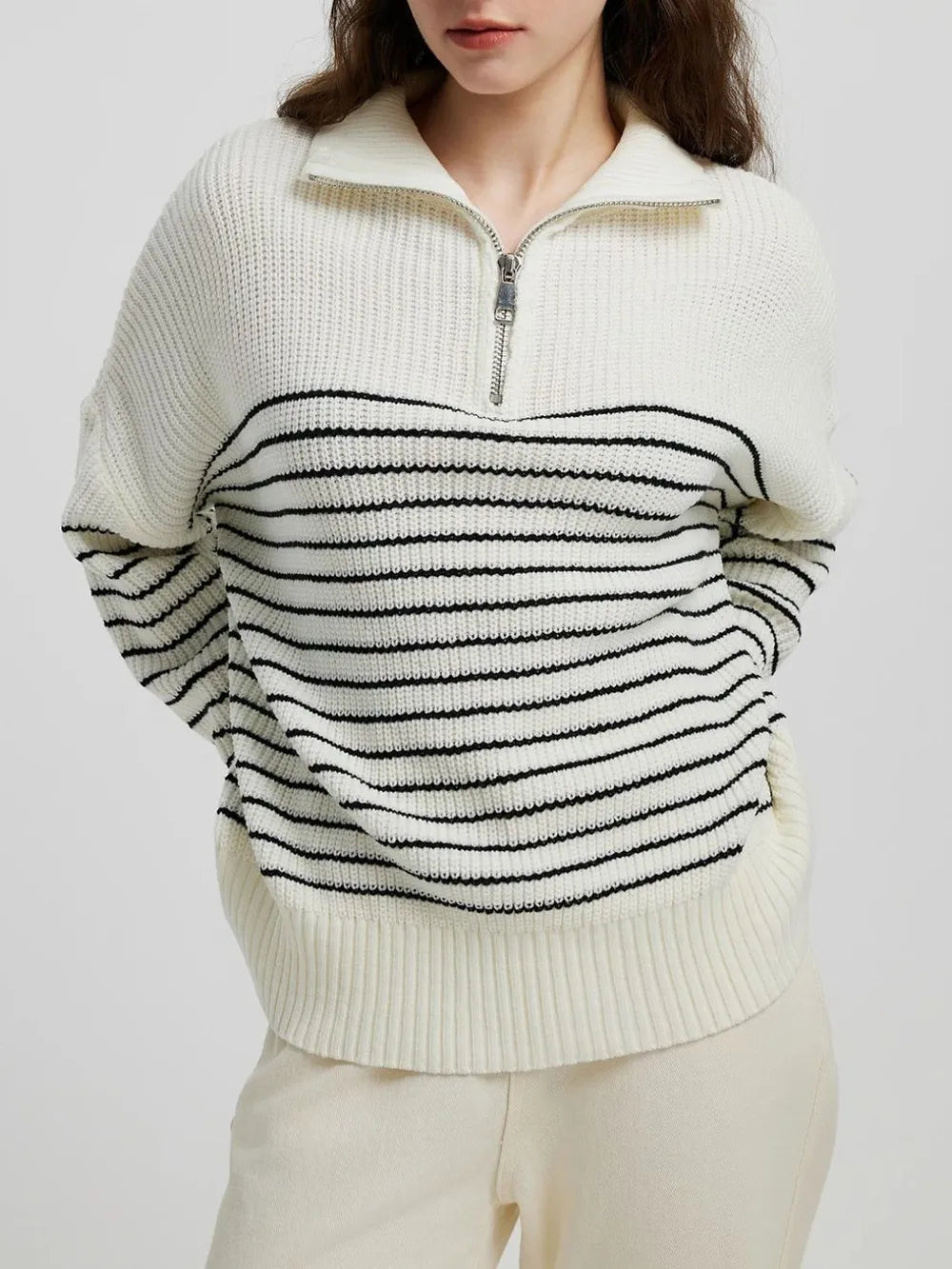 Cream striped half-zip knit sweater with long sleeves, ribbed hem and cuffs