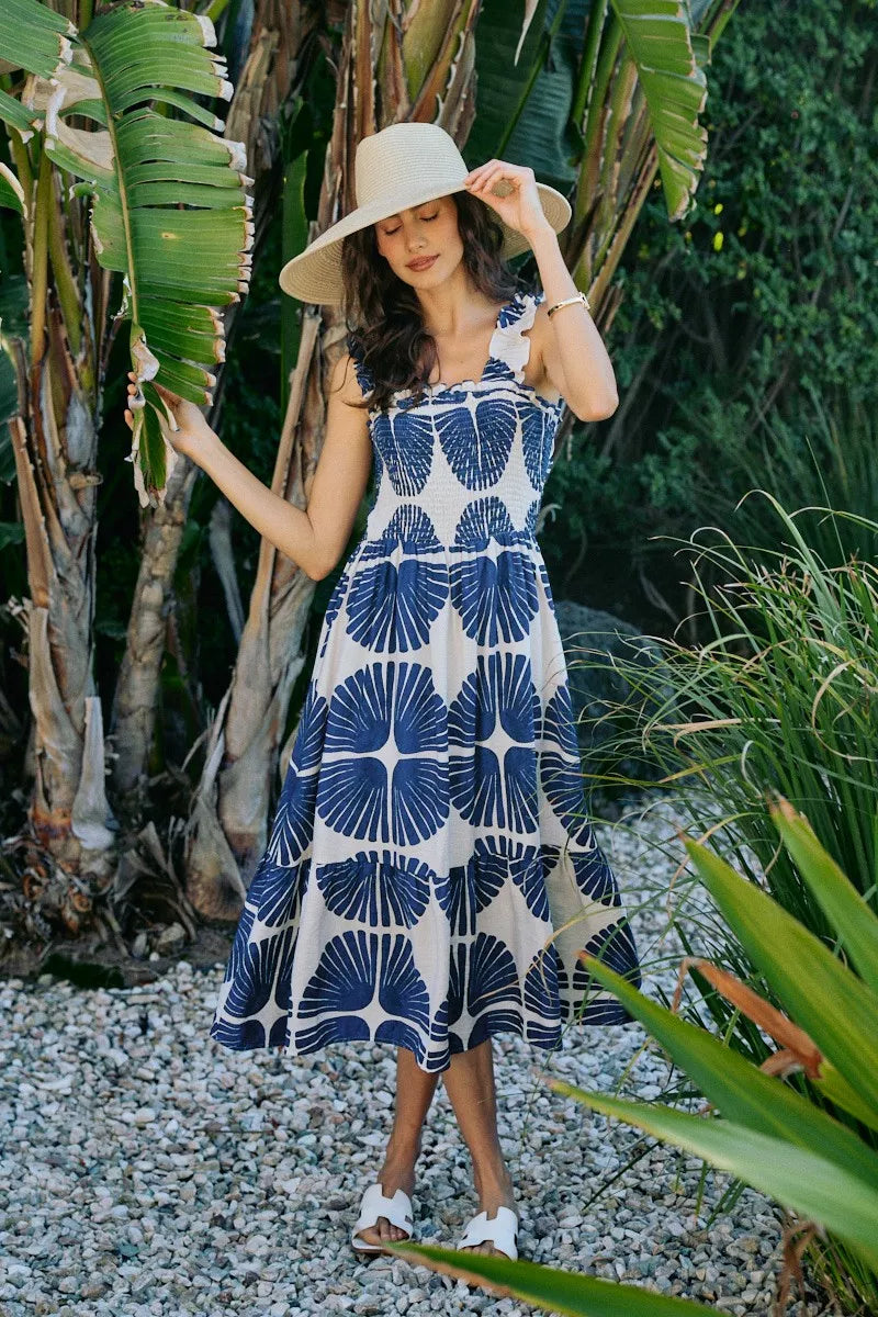 Abstract navy-and-white tiered midi dress with smocked bodice and spaghetti straps