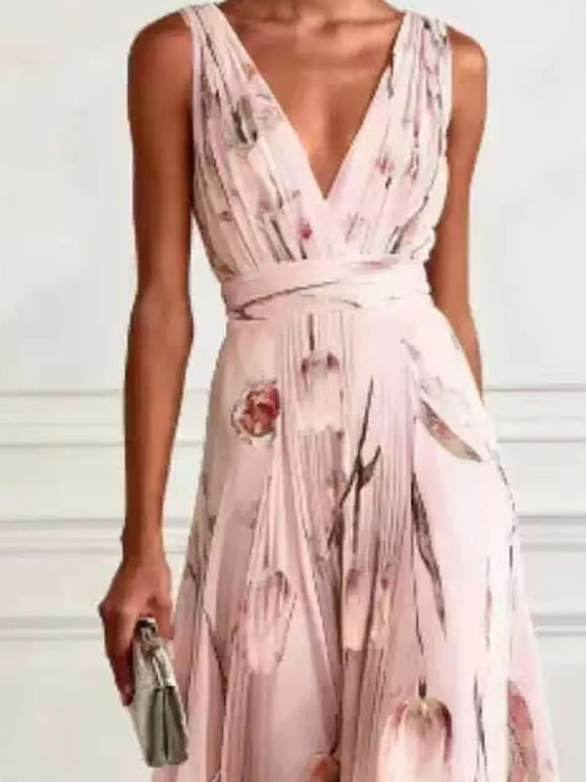 Light pink sleeveless floral print maxi dress with V-neck, ruched waist, and gathered skirt