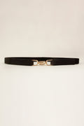 Black elastic belt with gold-tone buckle and center D-shaped detail