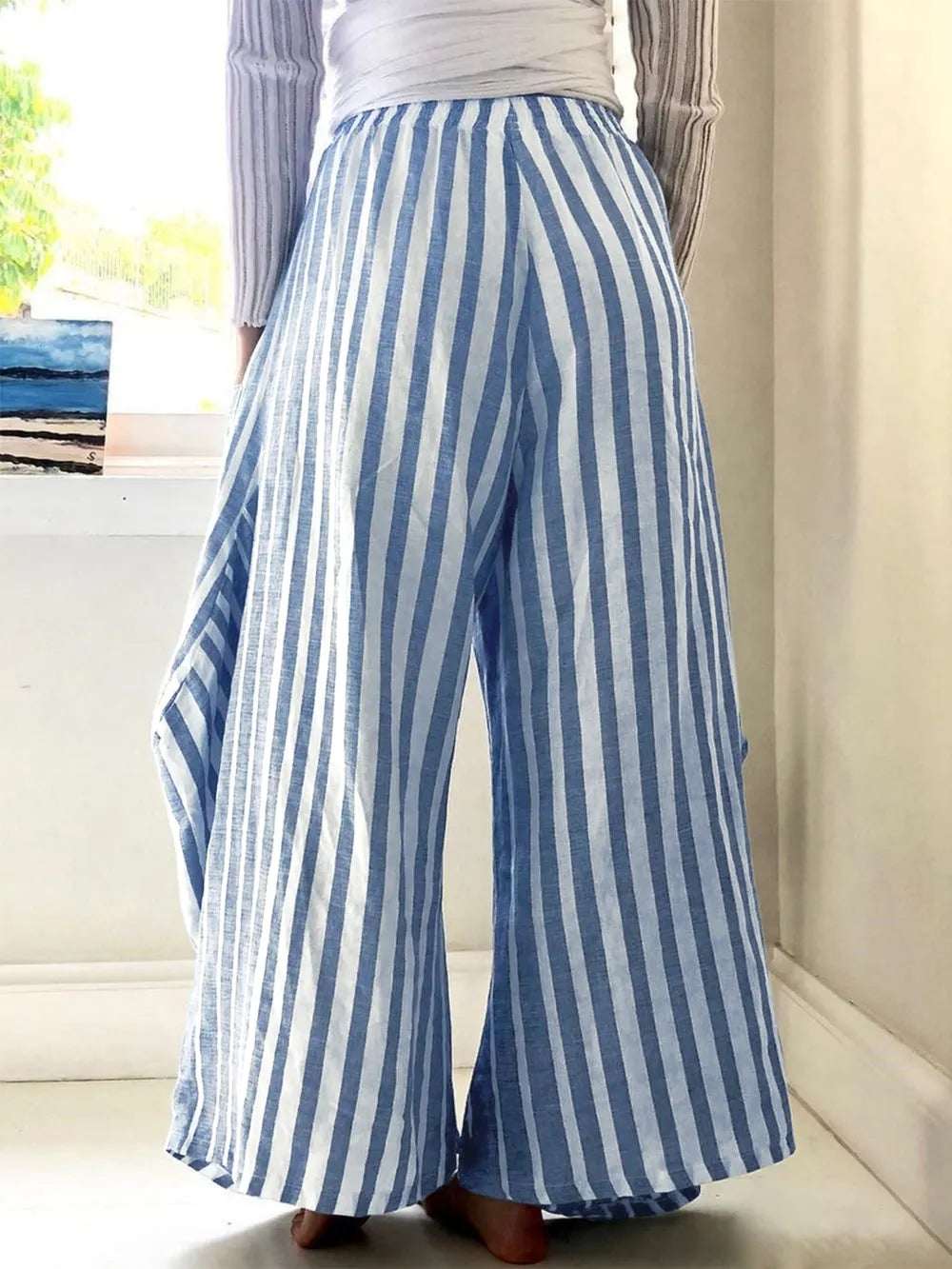 Light blue striped wide-leg pants with elastic waist, back view