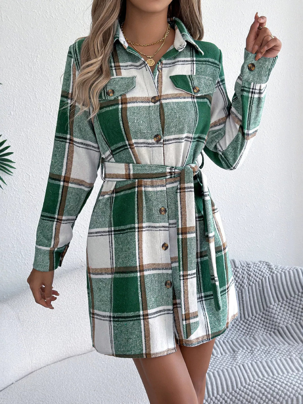 Green plaid belted button shirt dress with long sleeves, button front, and belt