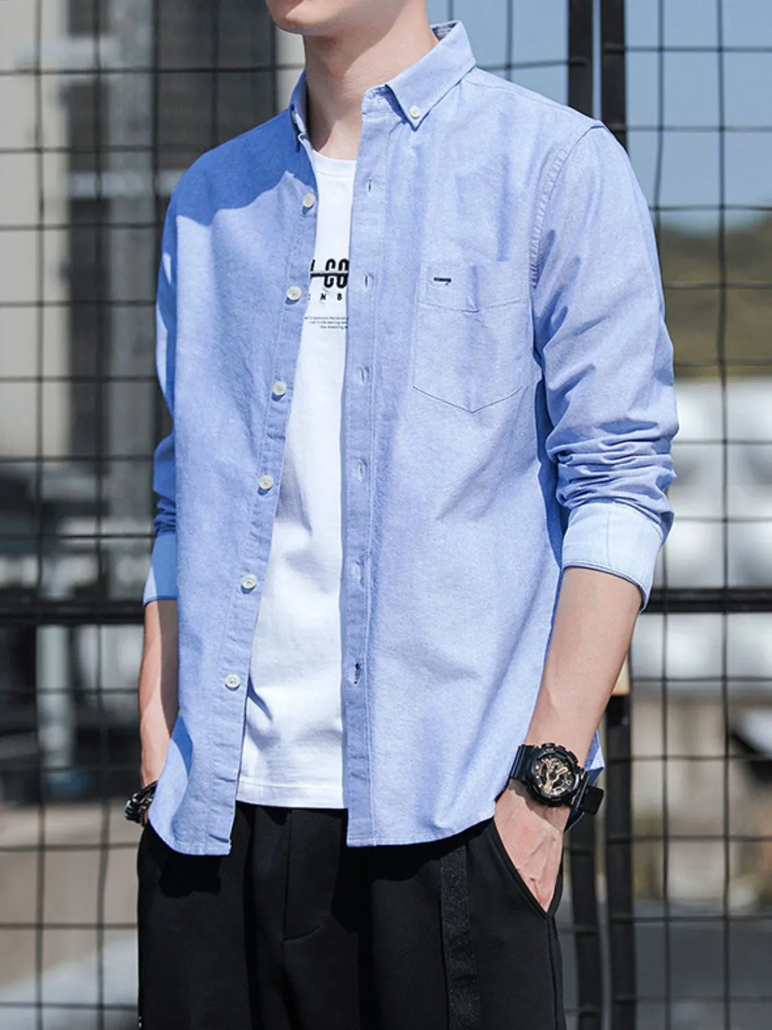 Light blue button-down casual shirt with chest pocket and button placket