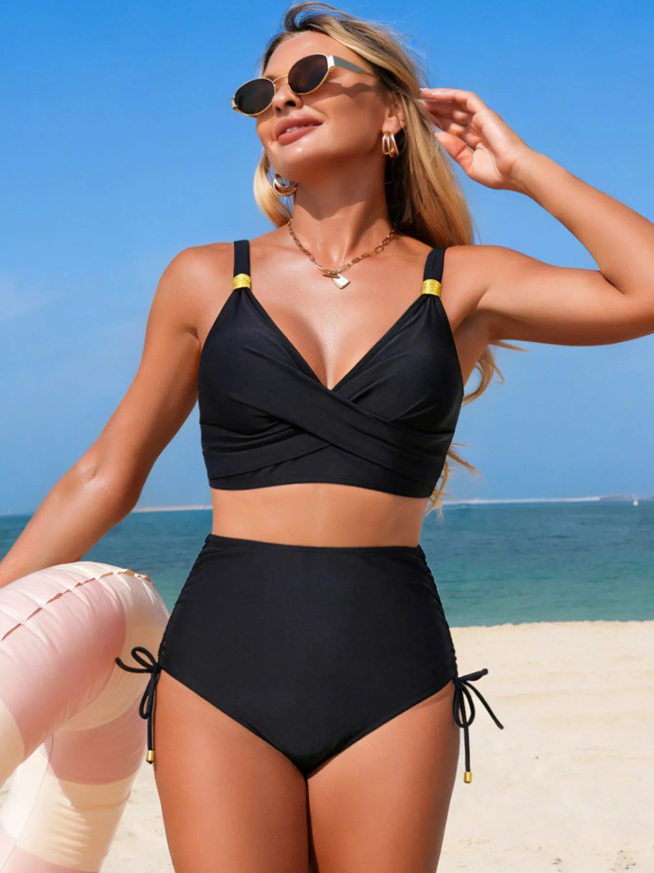 Crisscross high-waisted swim set in black with drawstring side ties and gold strap accents by Trendsi