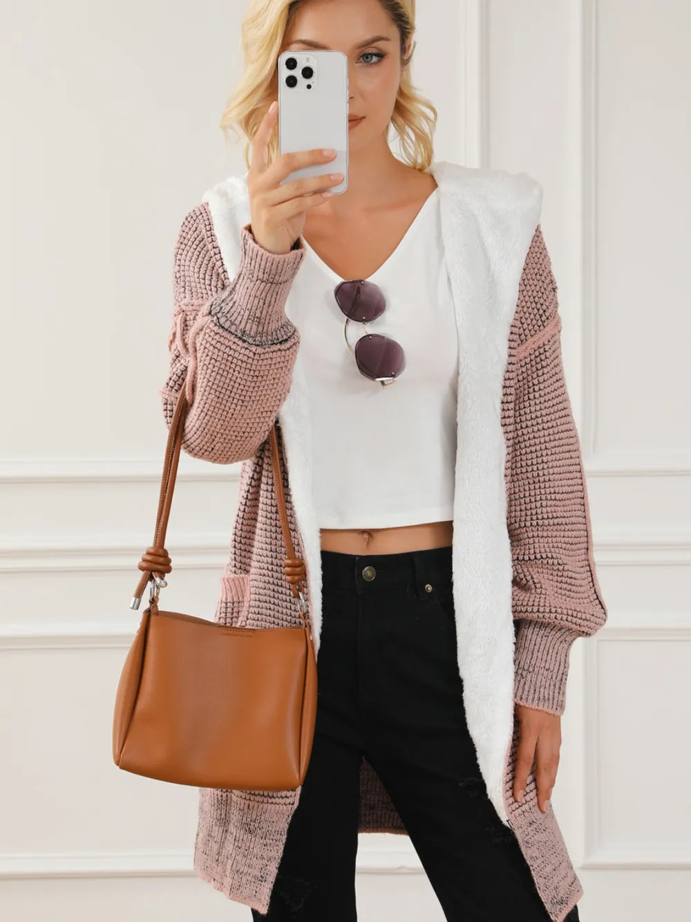 Open-front hooded winter coat with pockets, blush pink textured knit hooded front with tie detail.