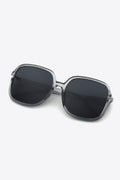 Clear square sunglasses with dark lenses and silver-toned hinges