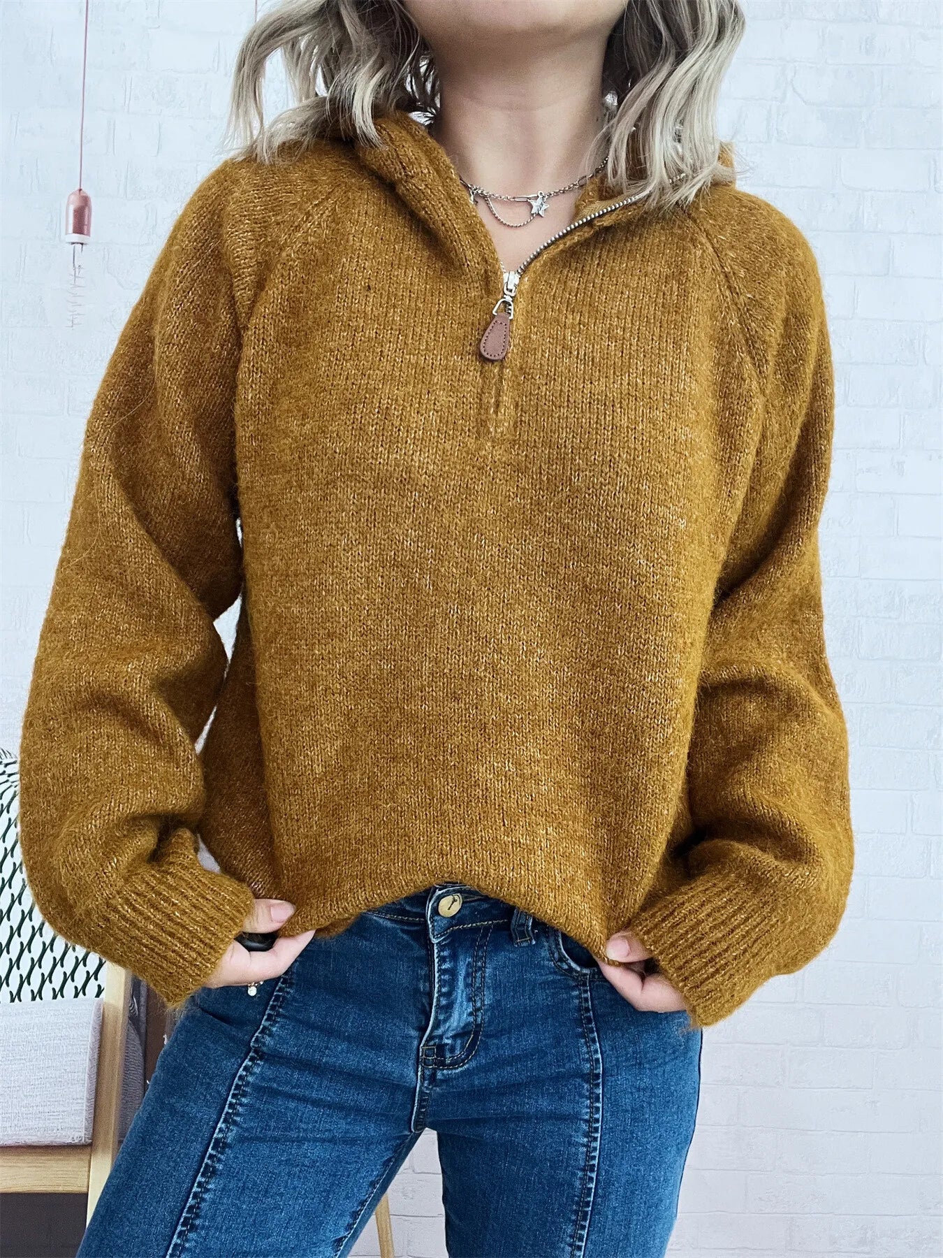 Brown quarter-zip sweater with ribbed hem and cuffs, long sleeves