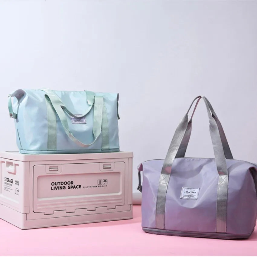 Light green and lavender duffle travel bags with long handles and front patch labels