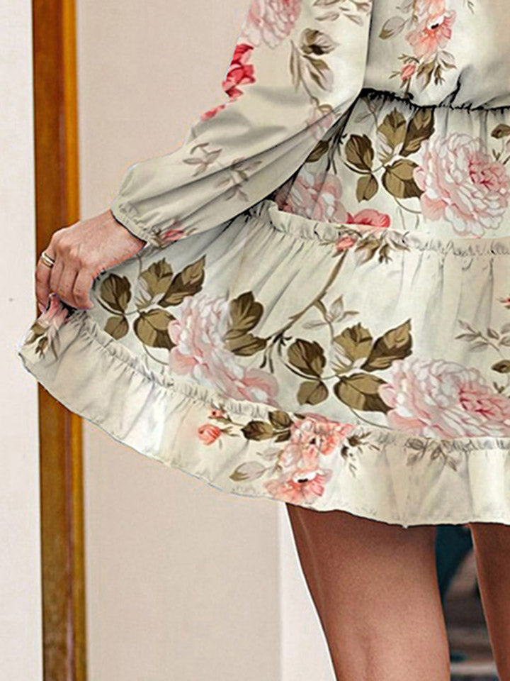 Ivory floral long-sleeve dress with ruched cuffs and tiered ruffle hem detail