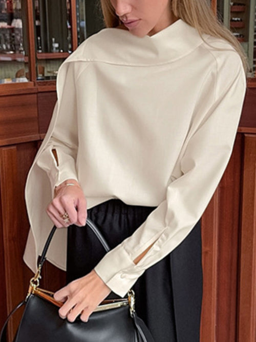 Beige asymmetrical high-collar long-sleeve blouse with relaxed, draped fit
