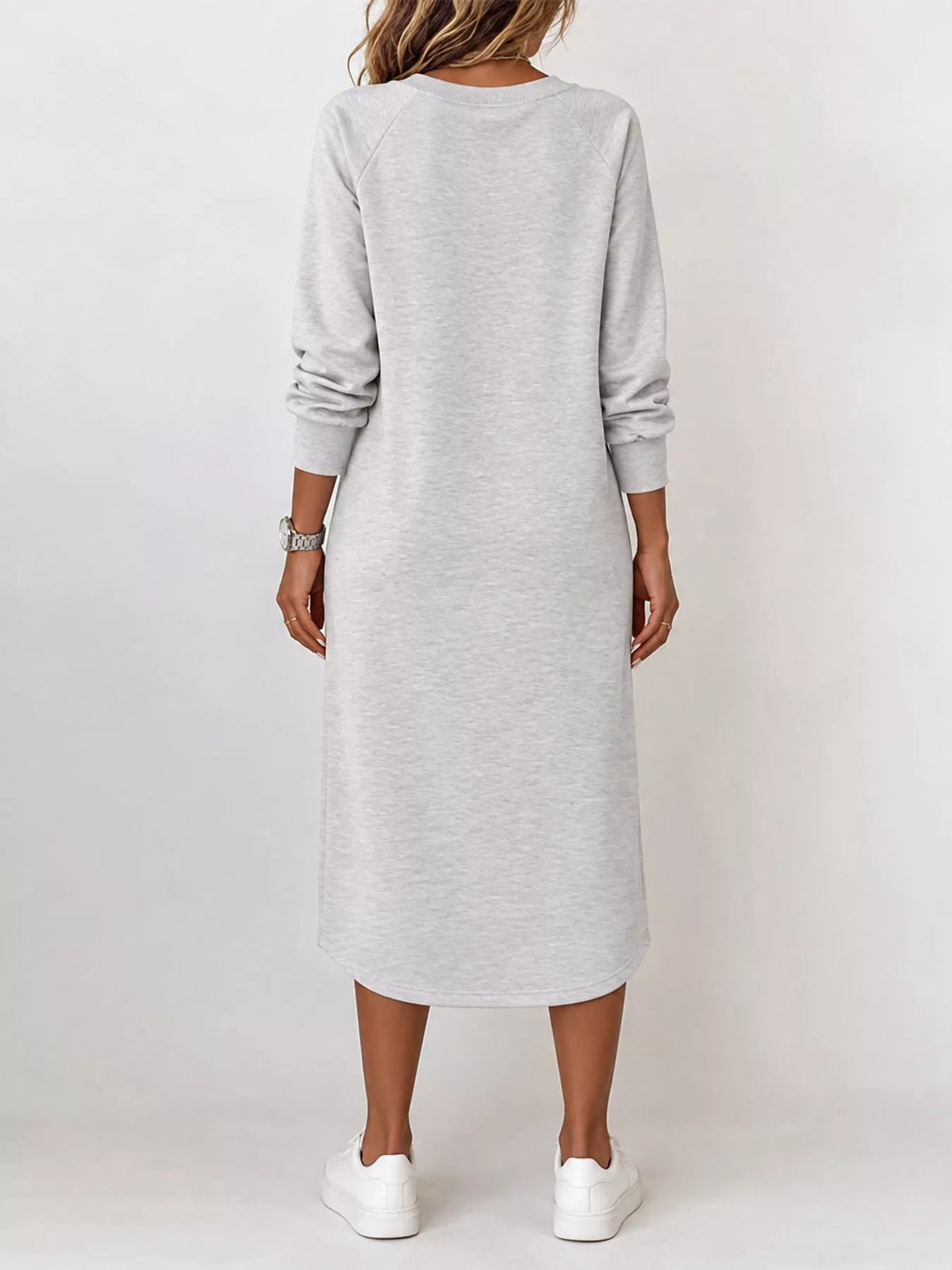 Light gray long-sleeve midi dress, V-neck style; back view with square patch