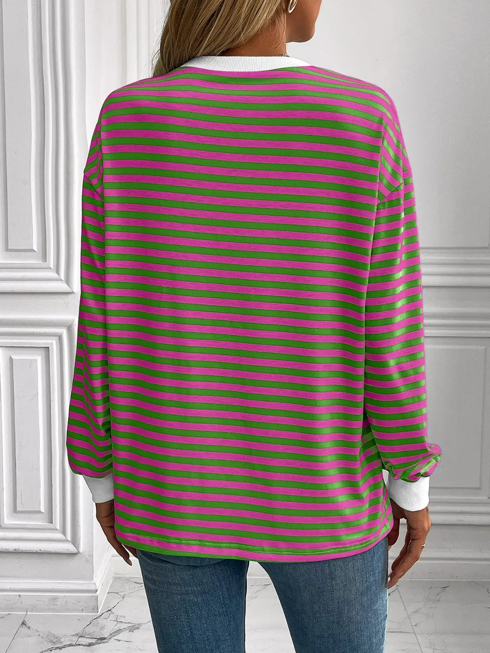 Green and pink striped round-neck sweatshirt with long sleeves, back view