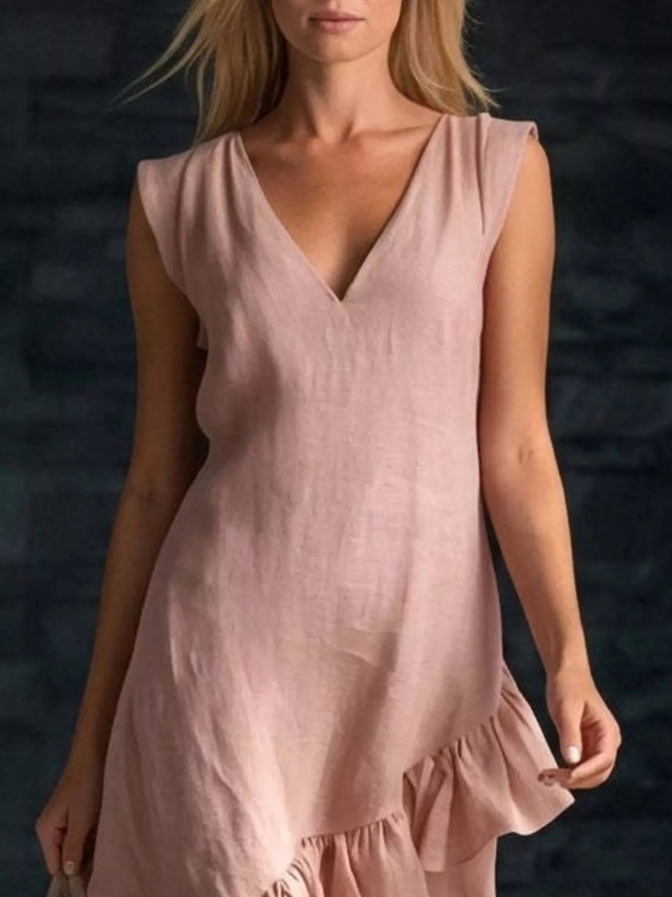 Light pink sleeveless asymmetrical V-neck dress with layered ruffle hem