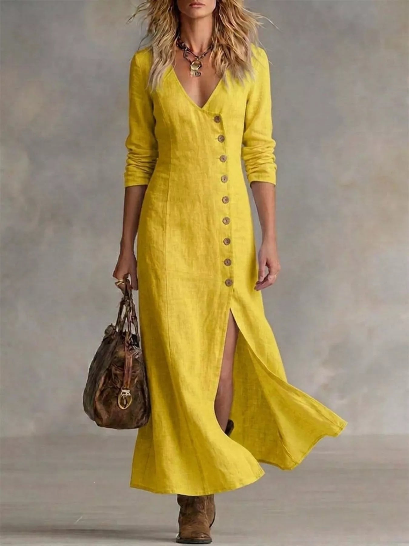 Yellow maxi dress with V-neck and button front, three-quarter sleeves, flowing skirt