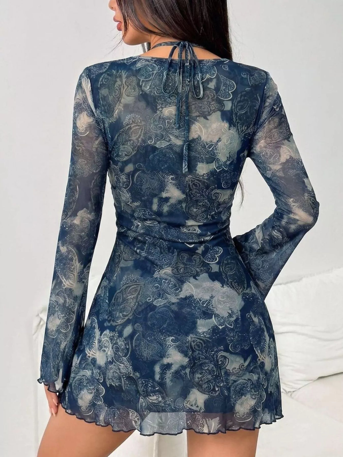 Navy mesh mini dress with long sleeves and open back tied detail at the waist