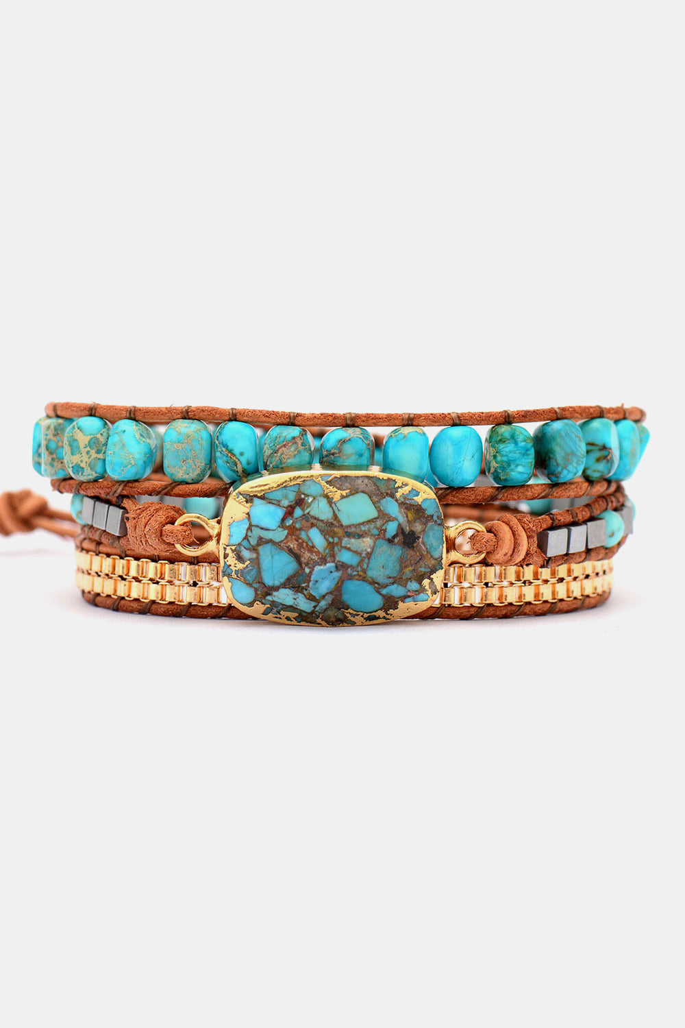 Turquoise stone cabochon copper bracelet with braided brown leather and gold-toned beads