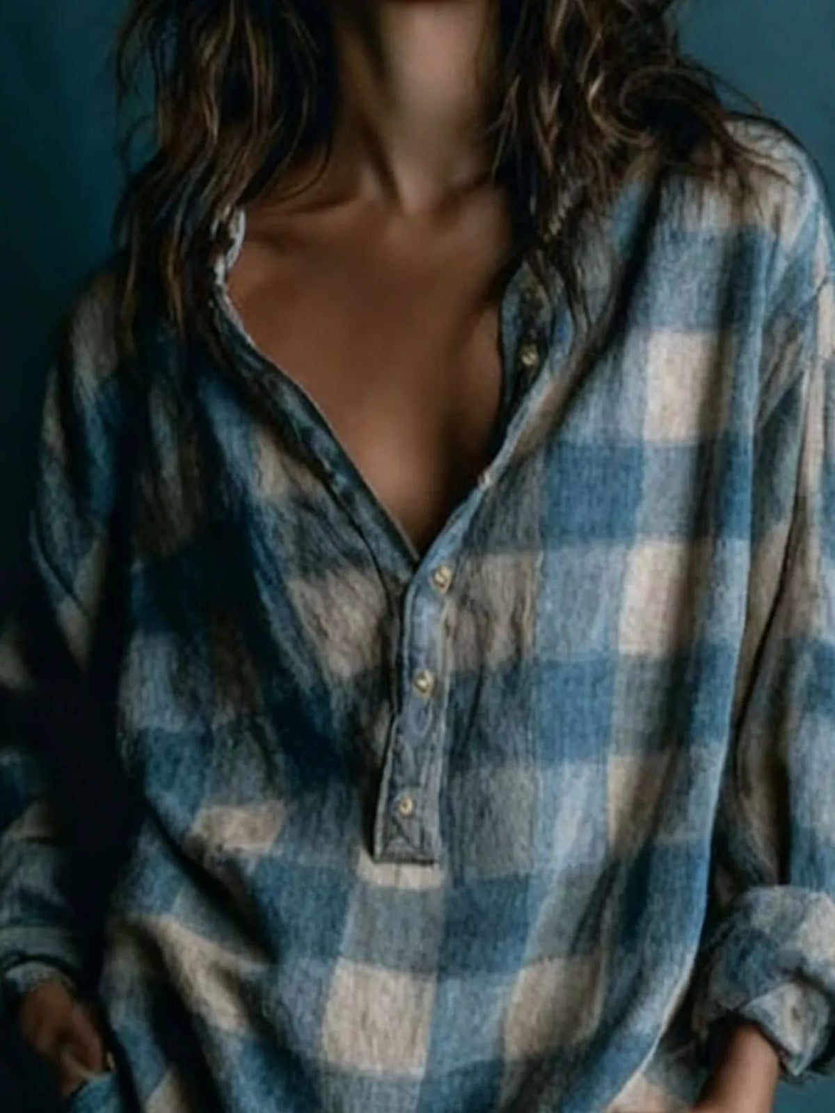 Close-up of plaid shirt dress V-neck placket and button front