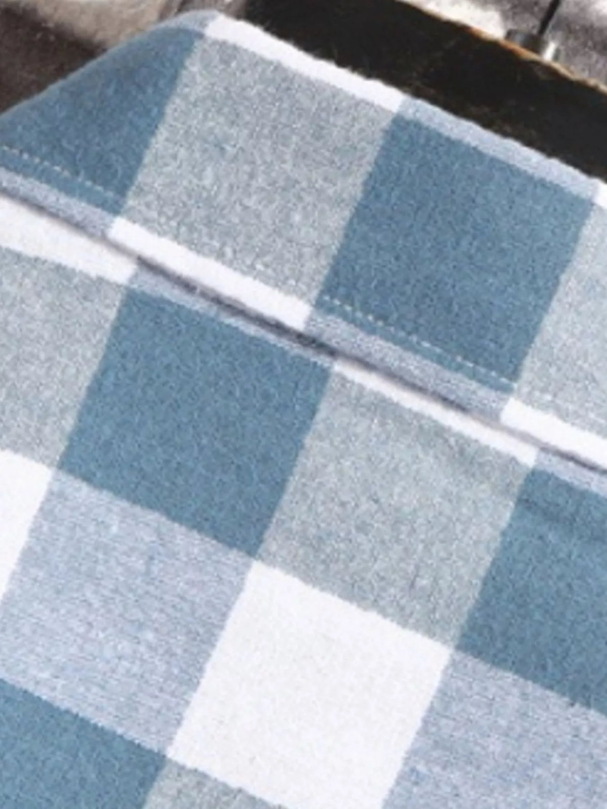 Blue and white plaid short-sleeve shirt fabric close-up