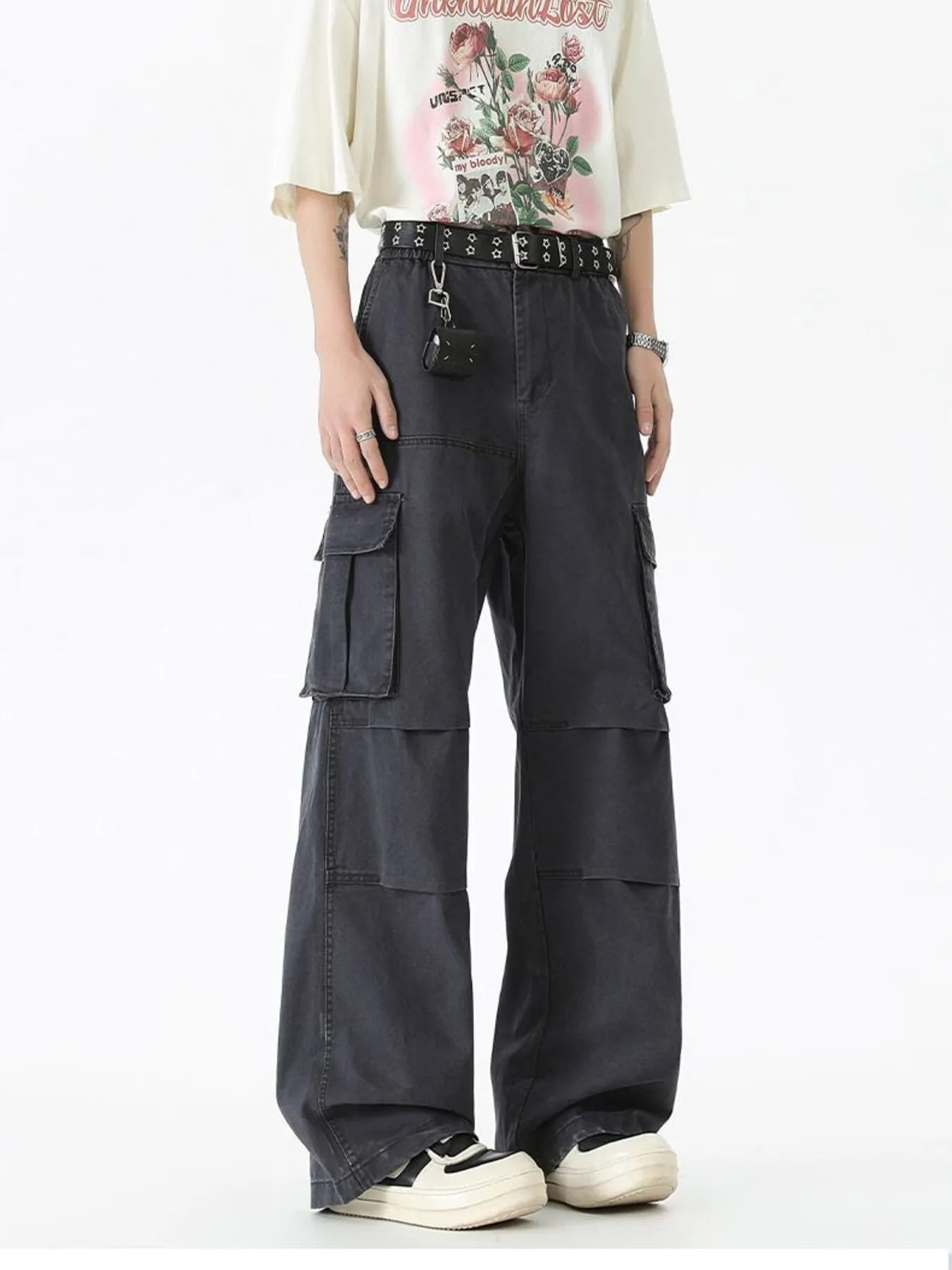 Black wide-leg cargo pants with multiple flap pockets and belt with key ring