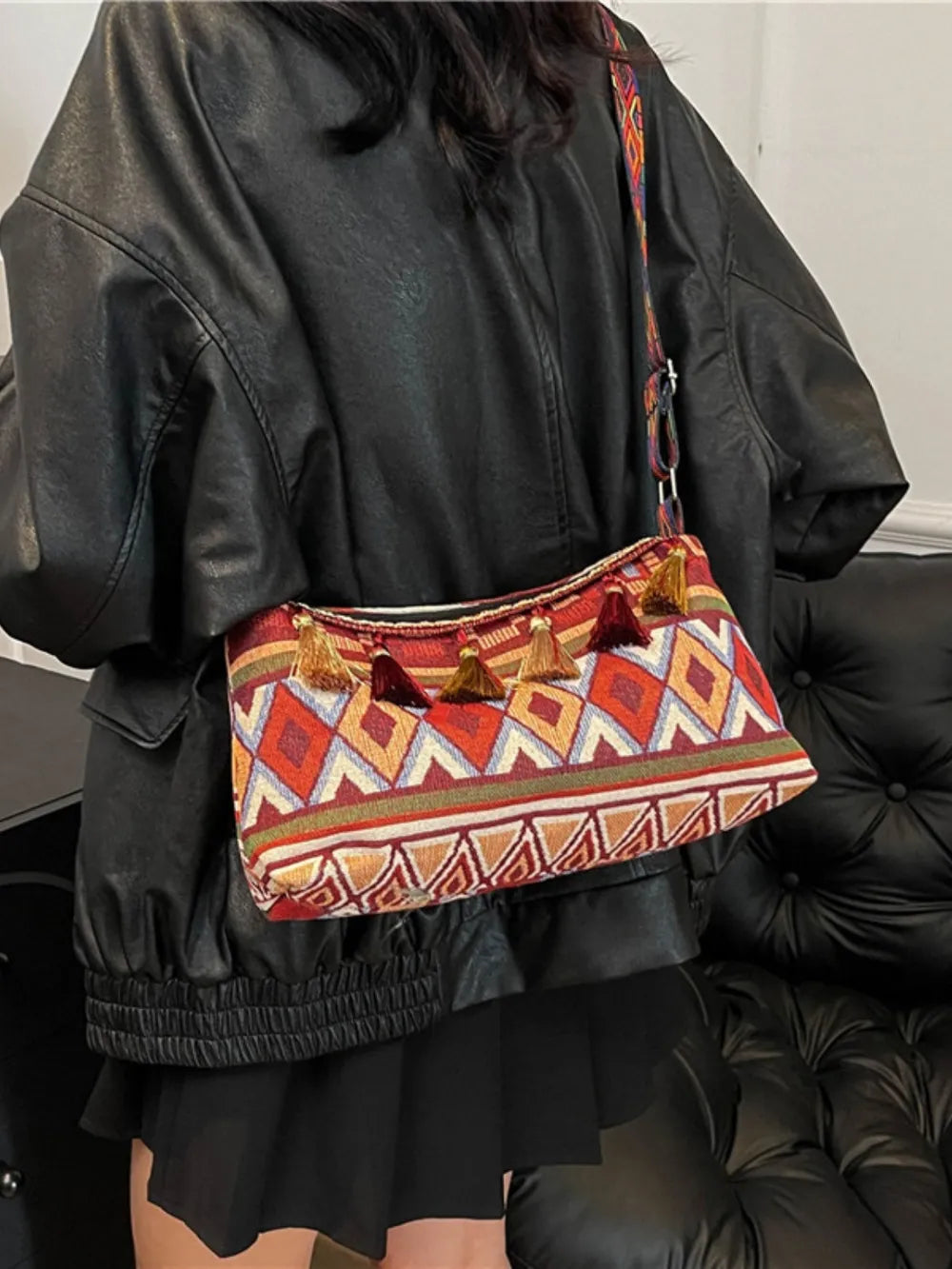 Tassel shoulder bag with geometric print and fringe tassels, short zipper top in red multicolor