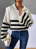 White ribbed knit cropped sweater with black-and-white striped bands and half-zip collar