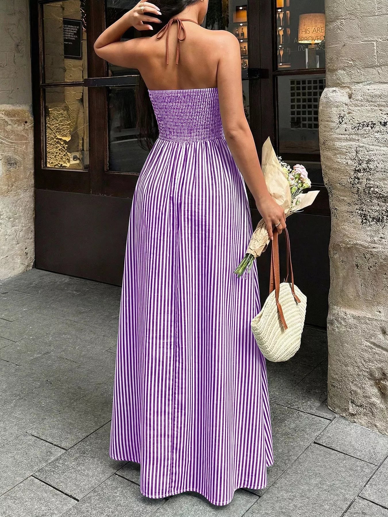 Cedar & Moore Striped halter-neck maxi dress in purple and white vertical stripes, smocked bodice, Trendsi.