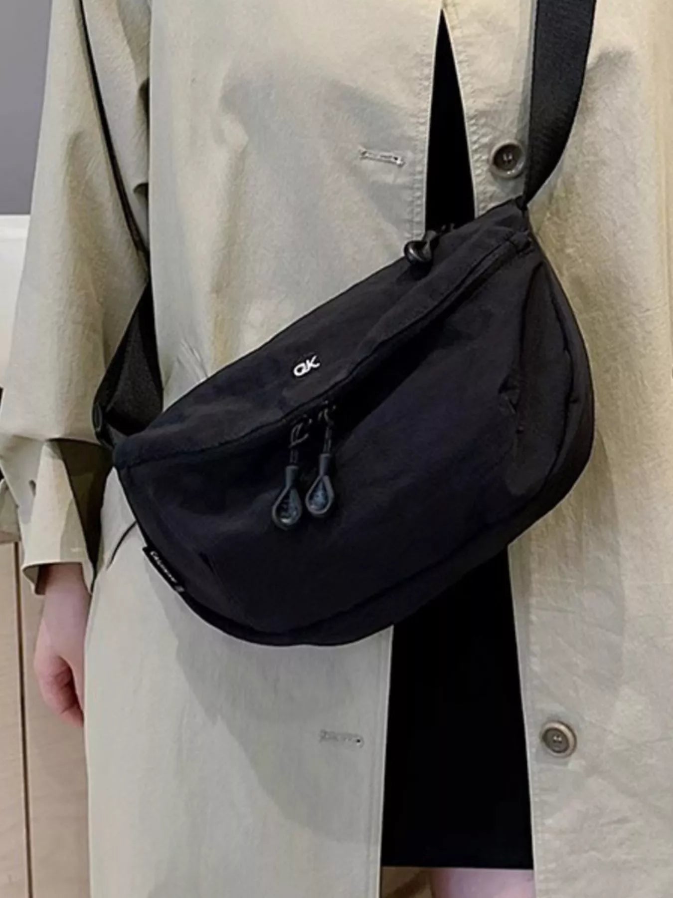 Lightweight nylon crossbody bag, black, medium size, with dual zippers and adjustable strap OK logo.
