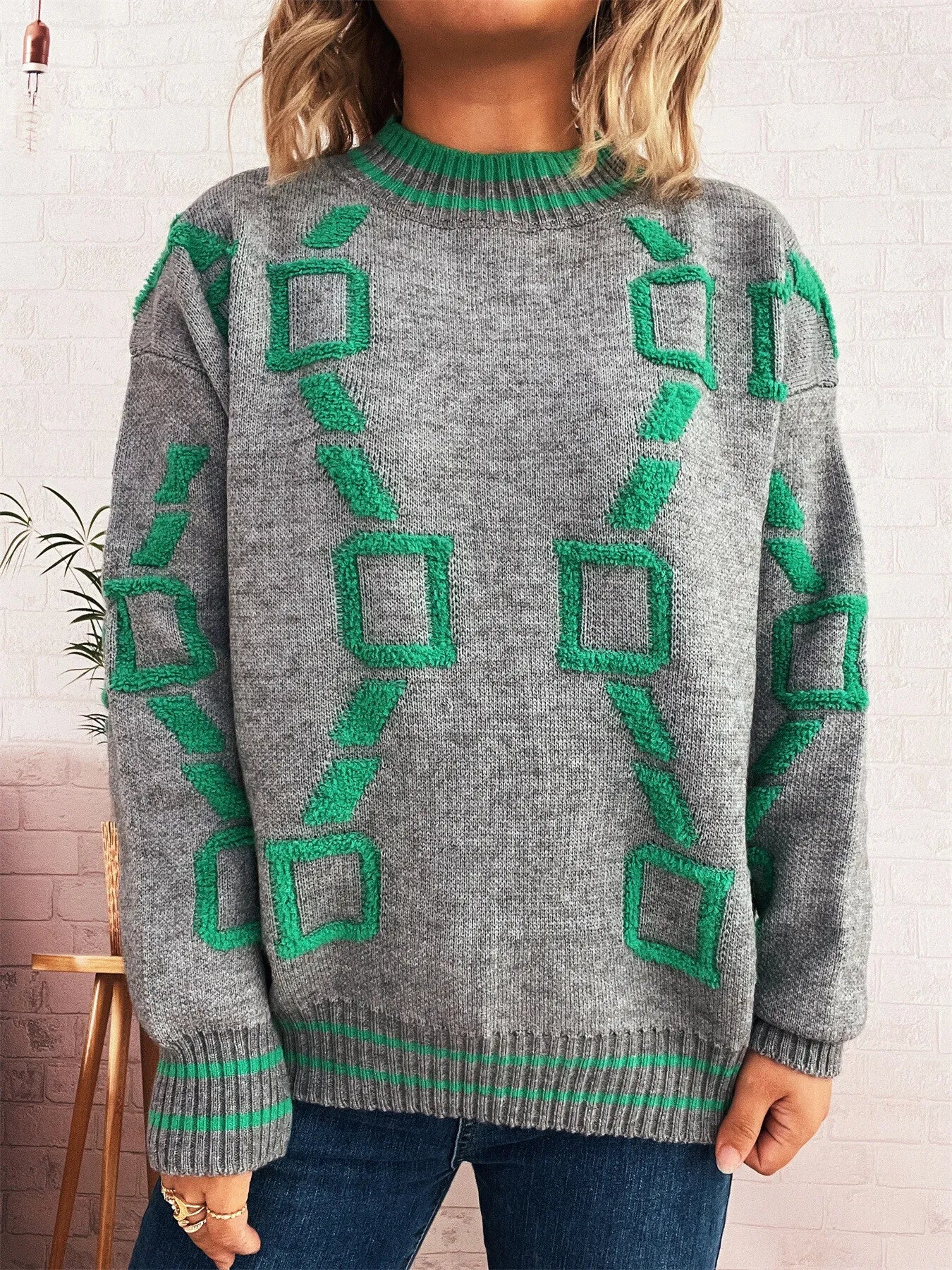 Grey long sleeve sweater with green geometric print and ribbed round neck