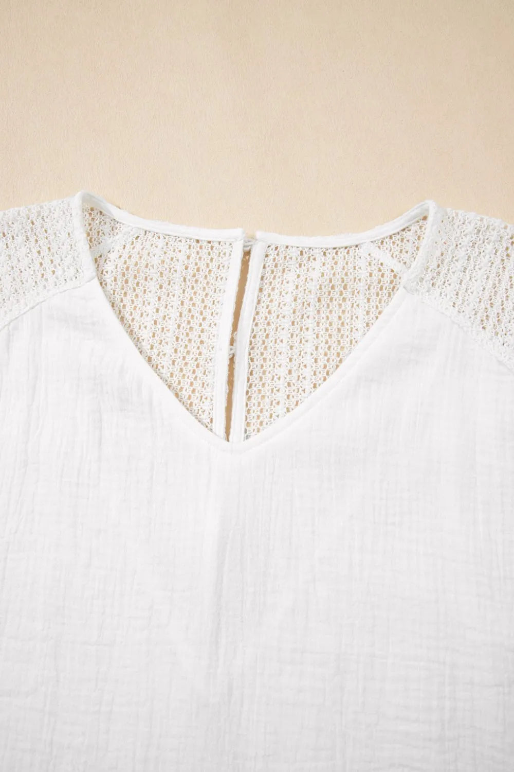 Cedar & Moore Lace Crochet Textured V-neck T-shirt in white with openwork shoulders and button-back detail