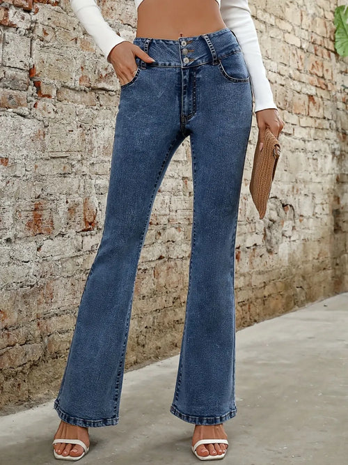 Medium blue bootcut jeans with button fly, belt loops, and front pockets