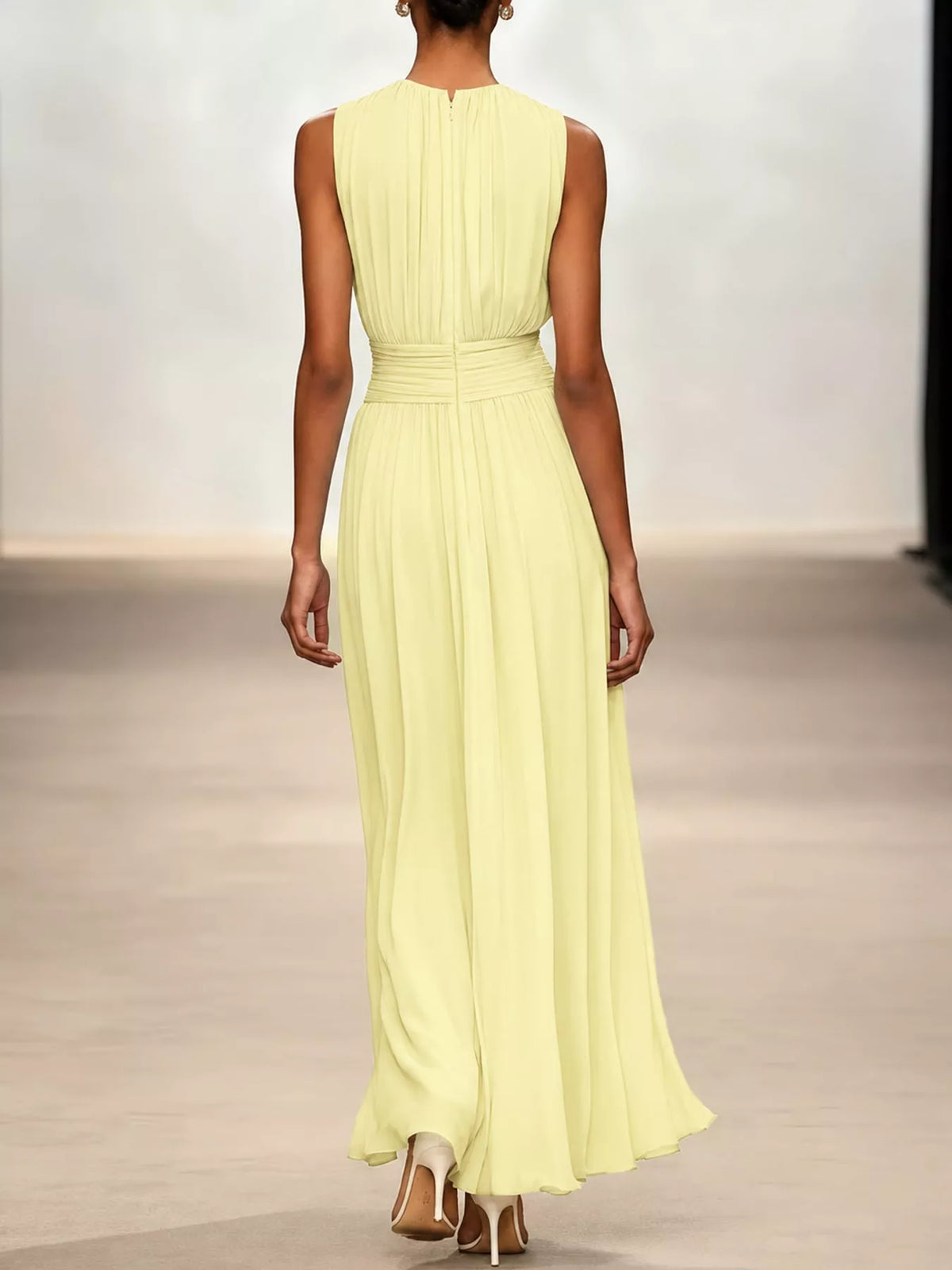 Light yellow sleeveless chiffon maxi dress with vertical pleats and cinched waist