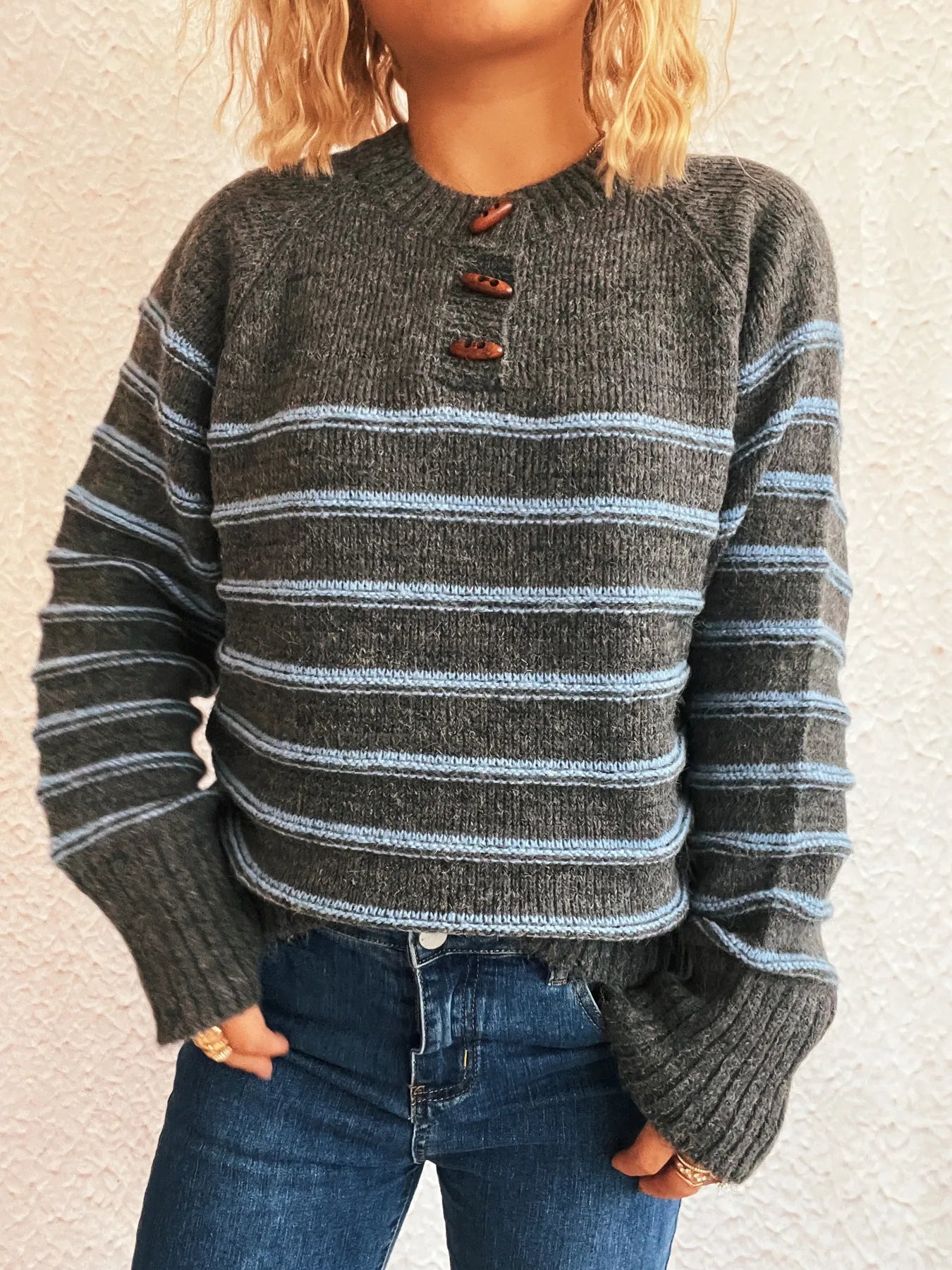 Dark gray striped long sleeve sweater with button placket and ribbed sleeve cuffs