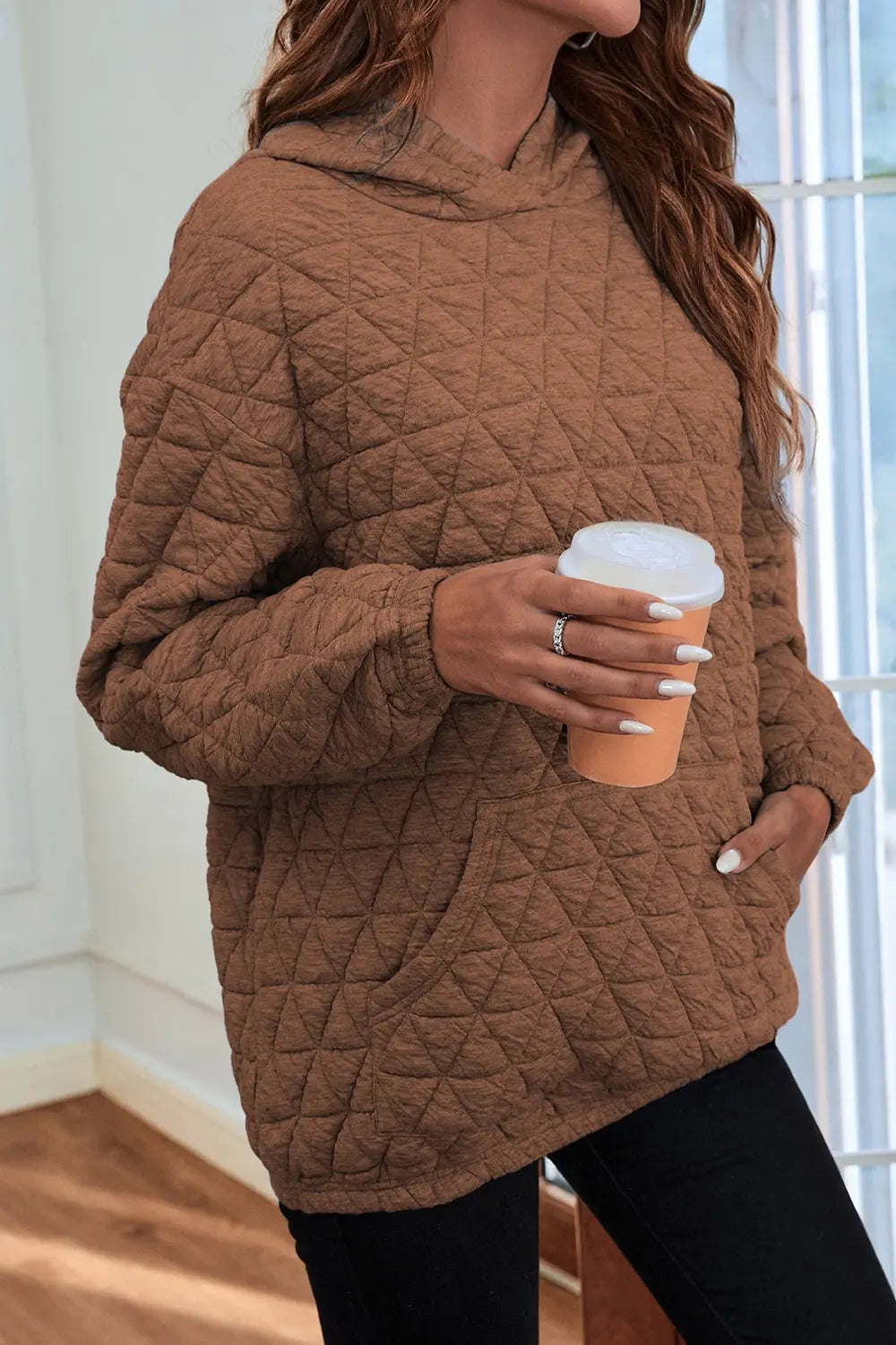 Brown quilted long-sleeve hoodie with hood and kangaroo pocket