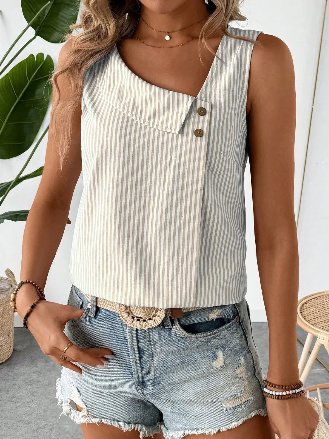 Beige pinstriped asymmetrical tank top with decorative button front