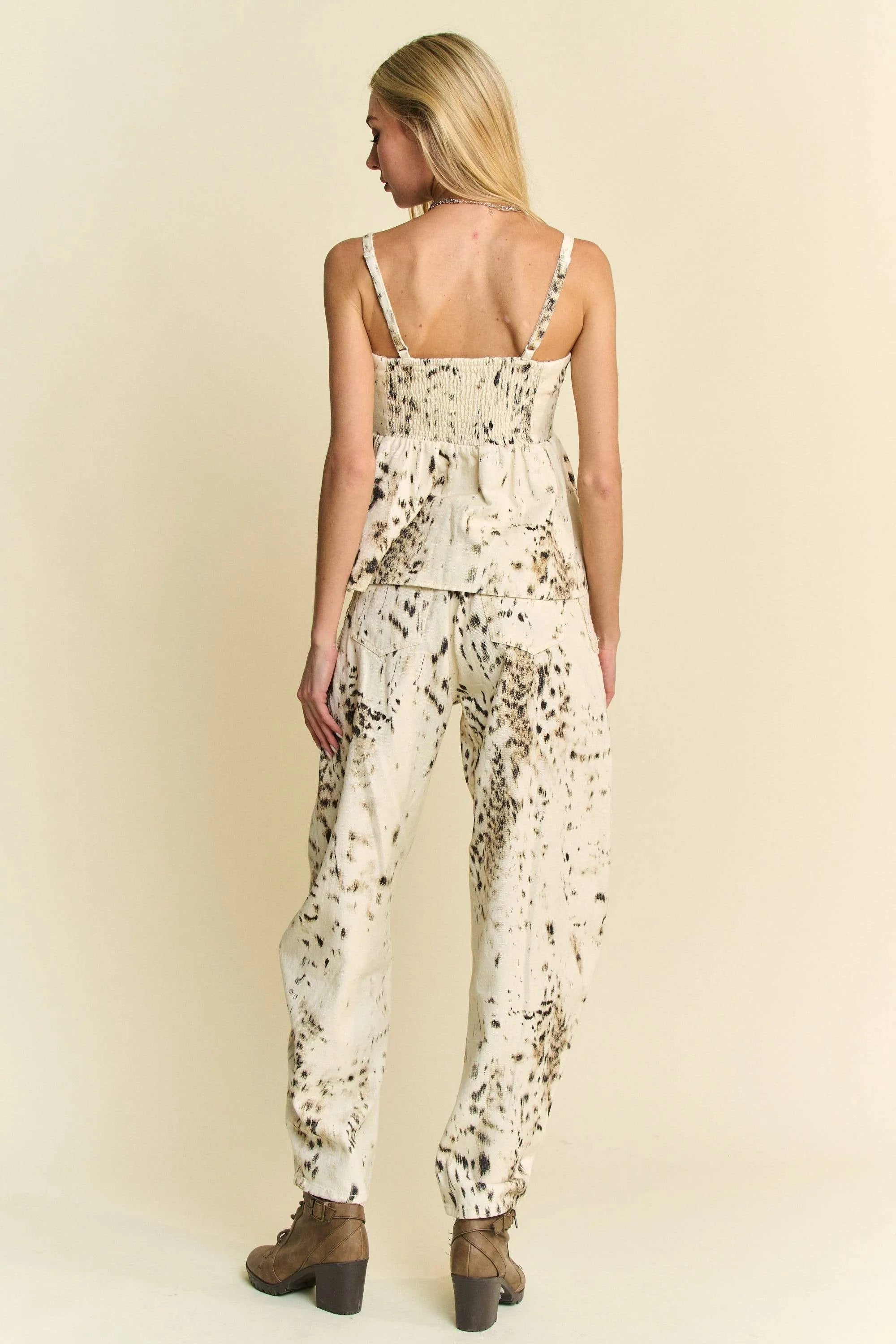 Cream barrel-leg pants with black dot abstract tie-dye print, back view
