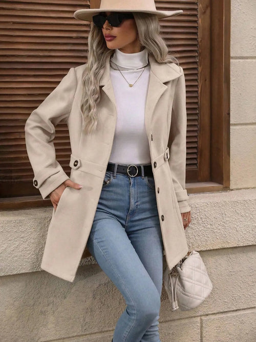 Light beige button-up long sleeve coat with notched collar and buttoned front placket.