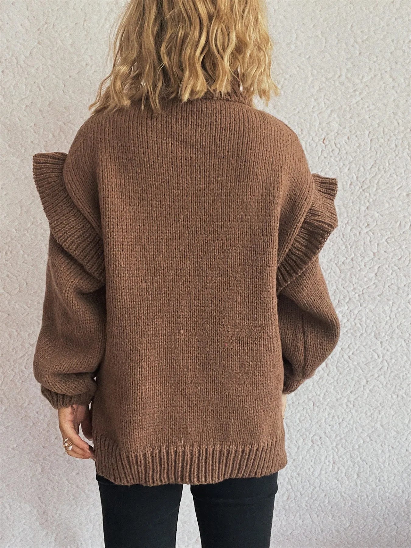 Brown ruffled turtleneck long-sleeve knit sweater, back view with ribbed hem