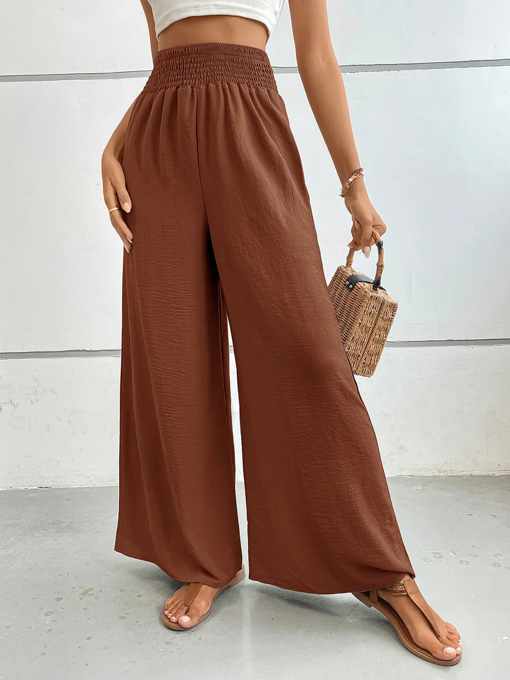 Wide-leg pants with pockets, dark brown textured weave, gathered elastic waist.