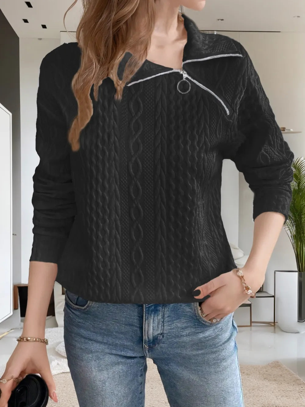 Black long-sleeve sweatshirt with collared neck and diagonal zipper detail, textured knit
