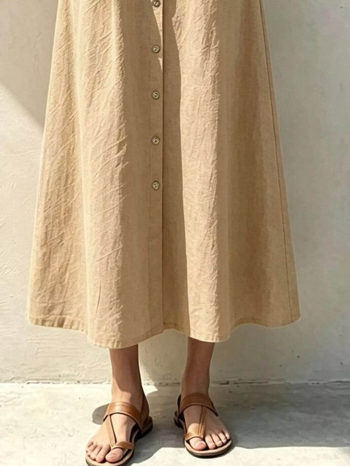 Tan button-front midi shirt dress with belt and side seam pockets