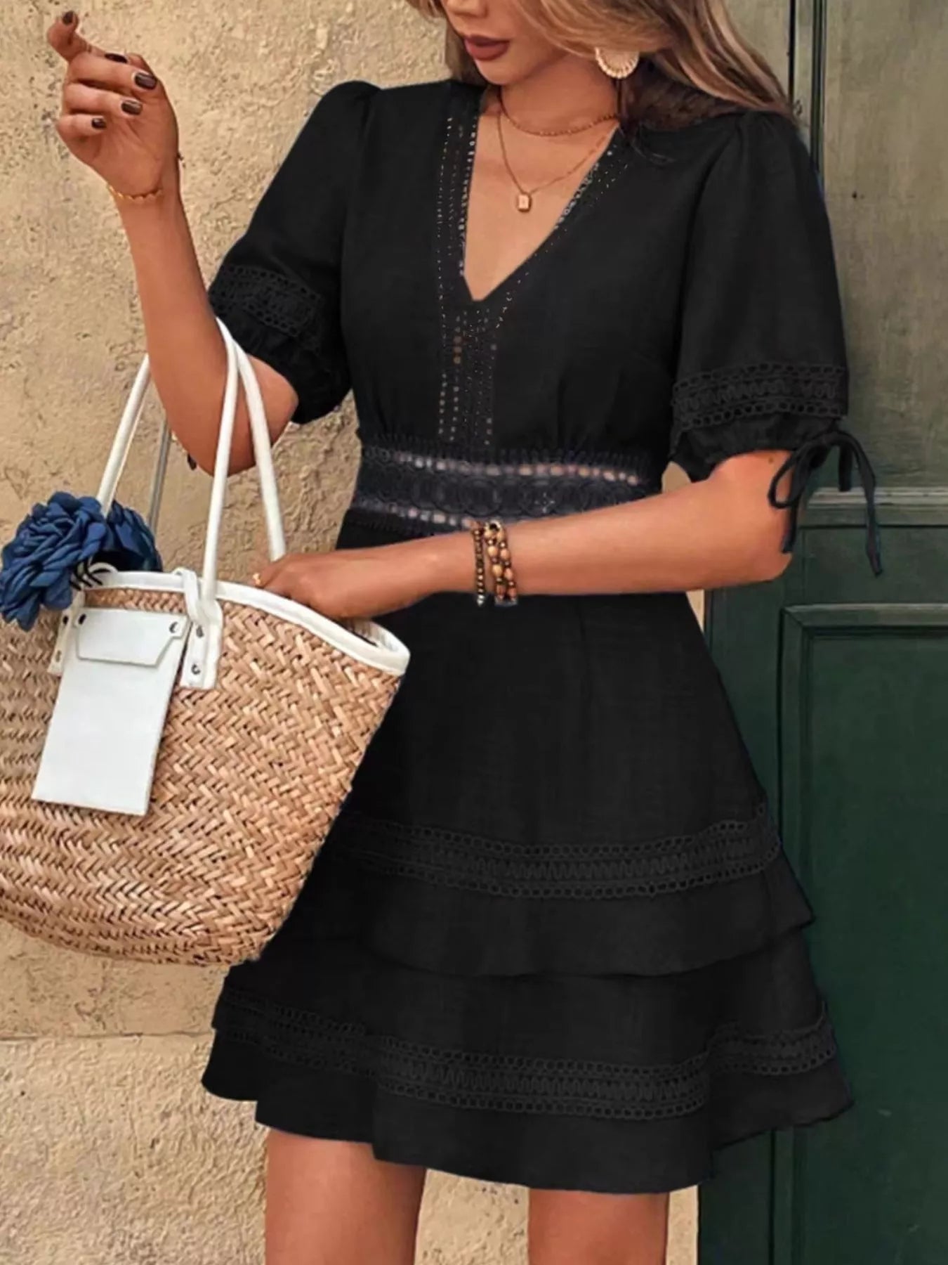 Black lace-detail V-neck mini dress with short sleeves and tiered ruffle skirt