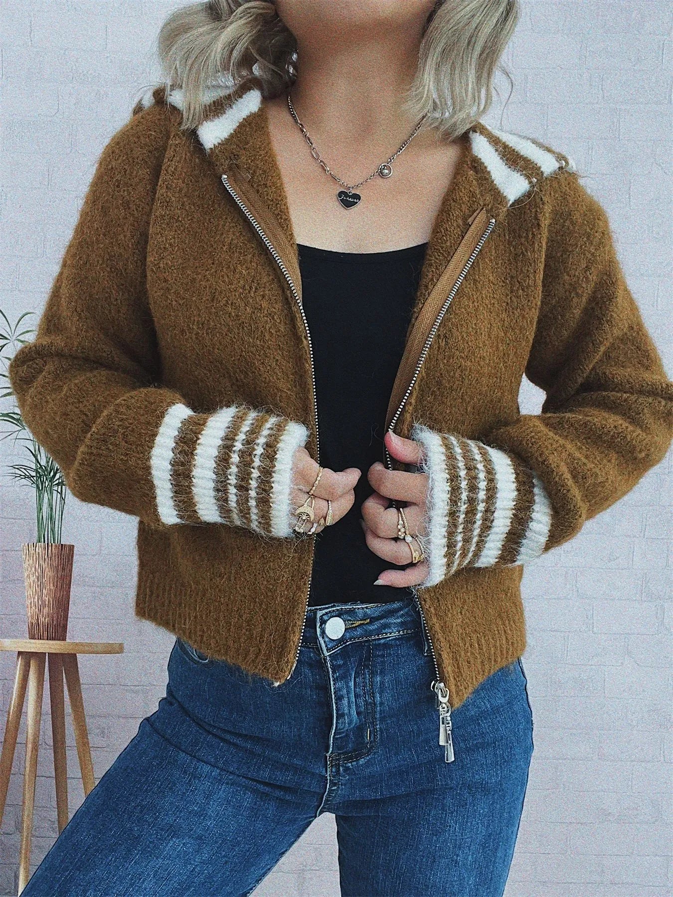 Brown zip-up cardigan with striped sleeve cuffs and hood trim, front zipper