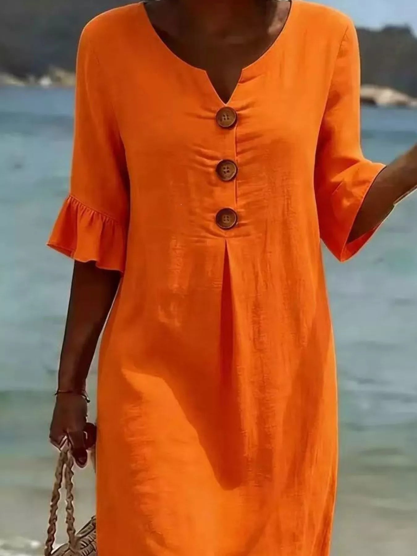 Orange midi dress with button placket and short flared ruffle sleeves