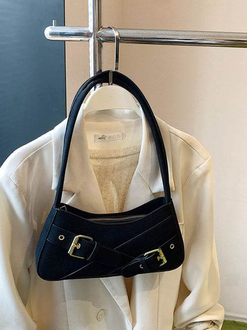 Black buckle decor shoulder bag with gold-tone hardware and top zip closure.