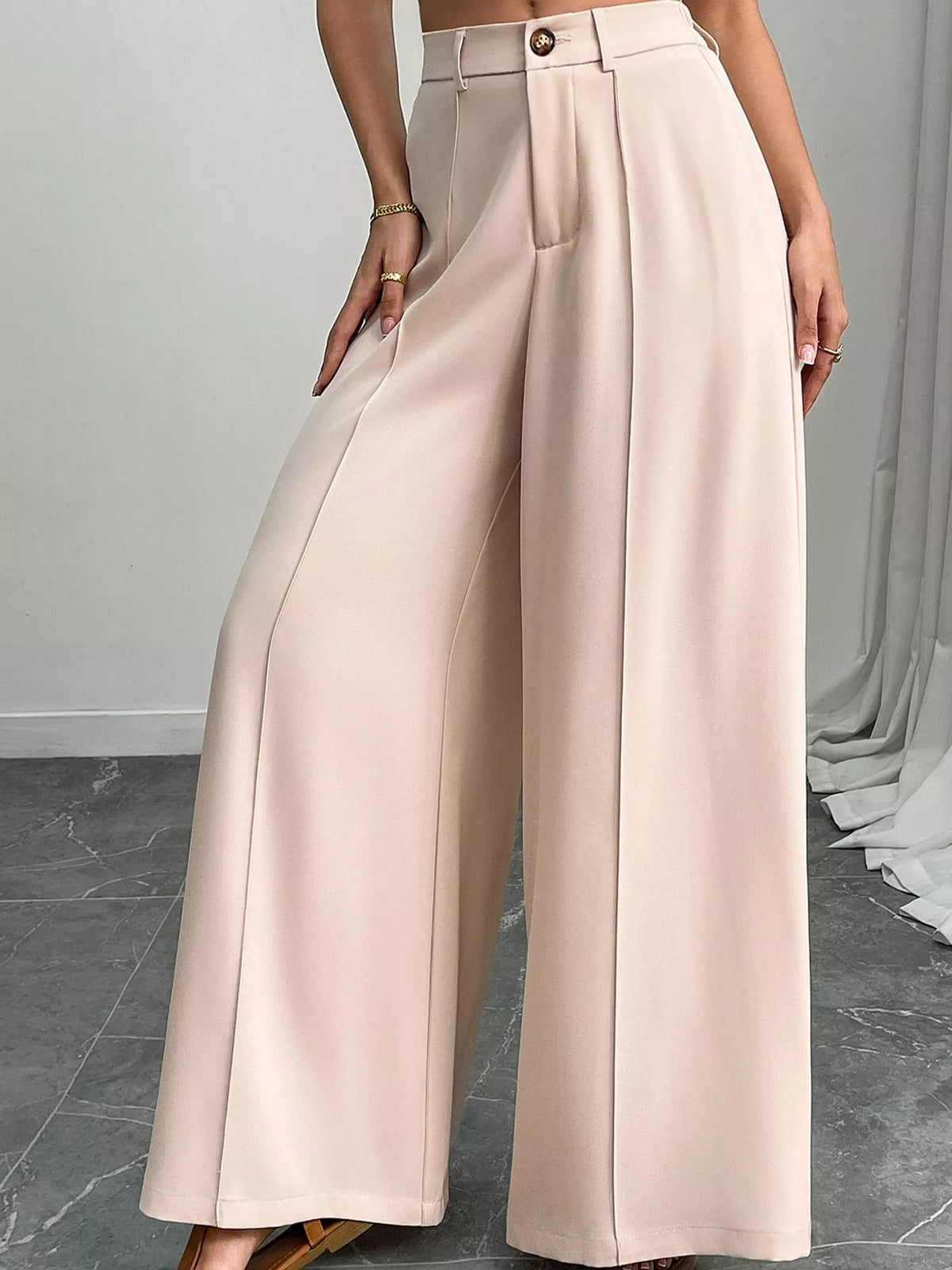 Apricot high-waisted wide-leg relaxed pants with pleats and button-front waist