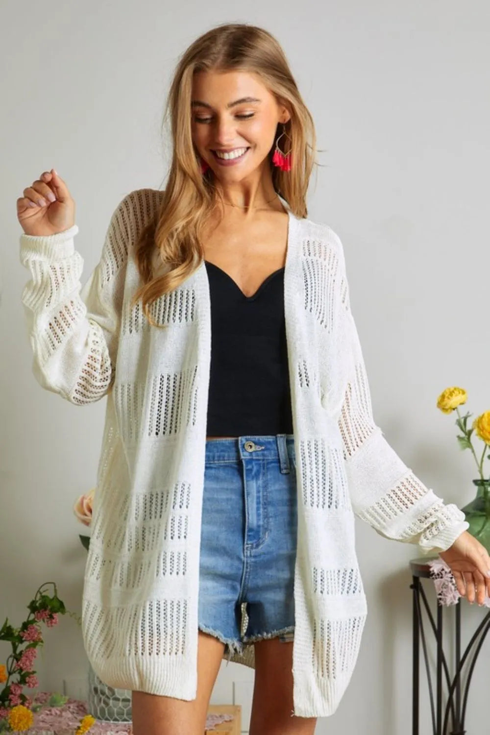 Ivory open-front knit cardigan with long sleeves and vertical crochet-style panel pattern