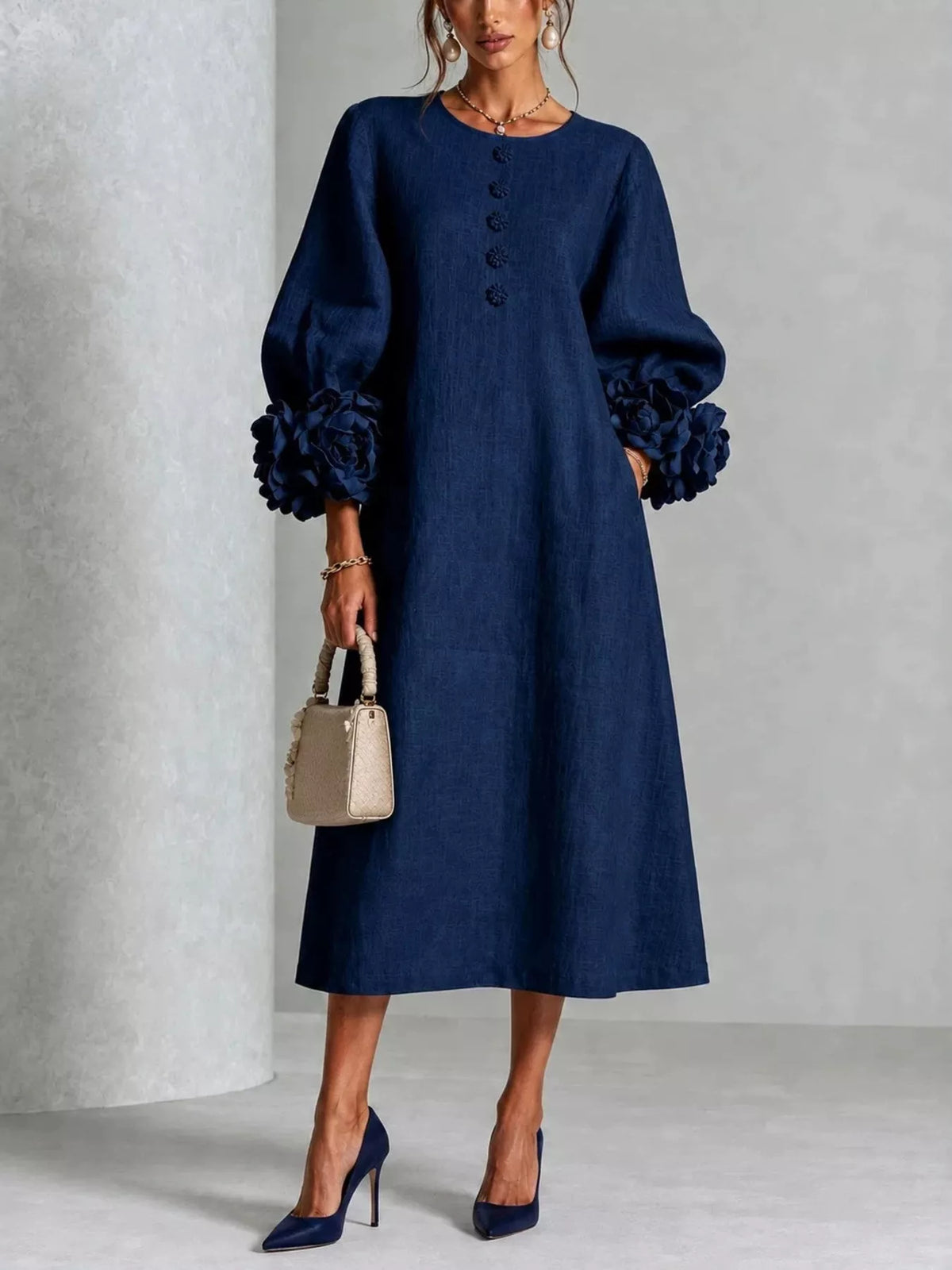 Navy round-neck button midi dress with rosette puff sleeves and textured fabric look